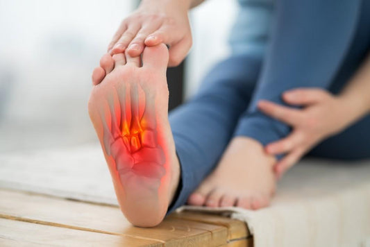 Why Flat Feet Cause Arch Pain and How Custom Orthotics Help